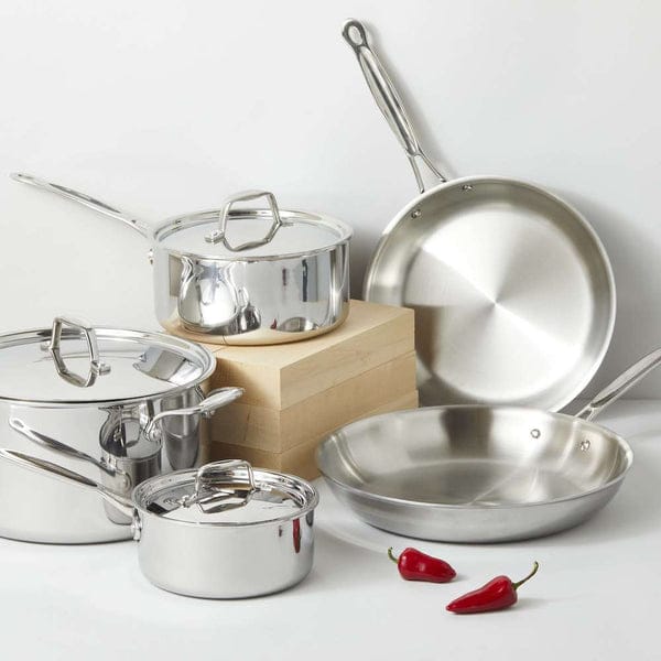 Side-by-side comparison of tri-ply and standard stainless steel pan bases